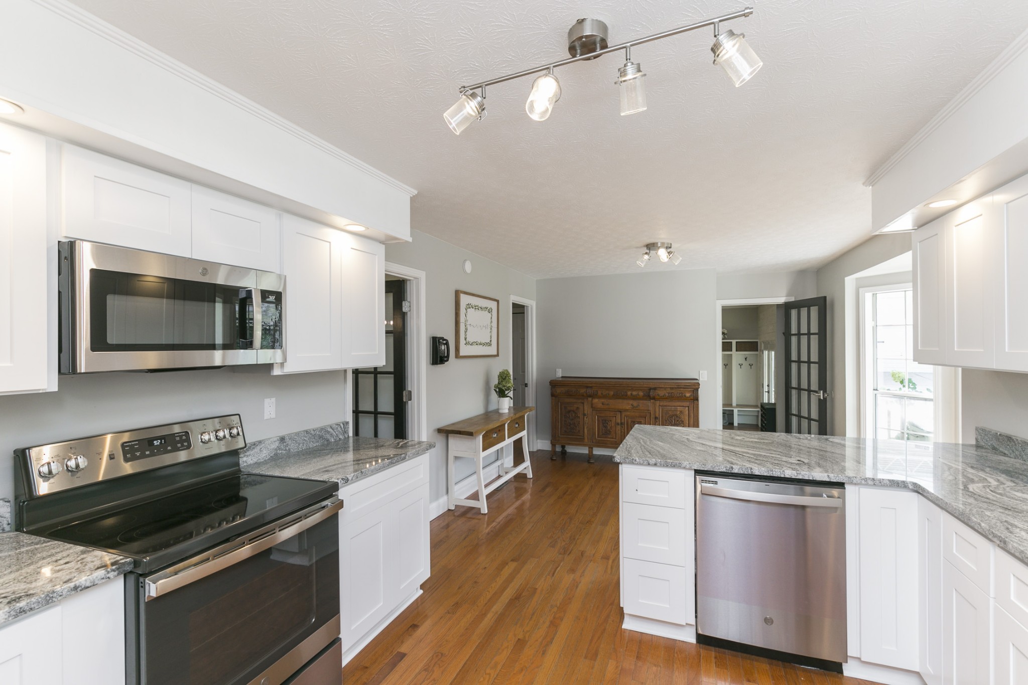 848 Philadelphia Road Lebanon, TN 37087 - Photo 5 of 50 a kitchen with stainless steel appliances granite countertop a stove and a microwave