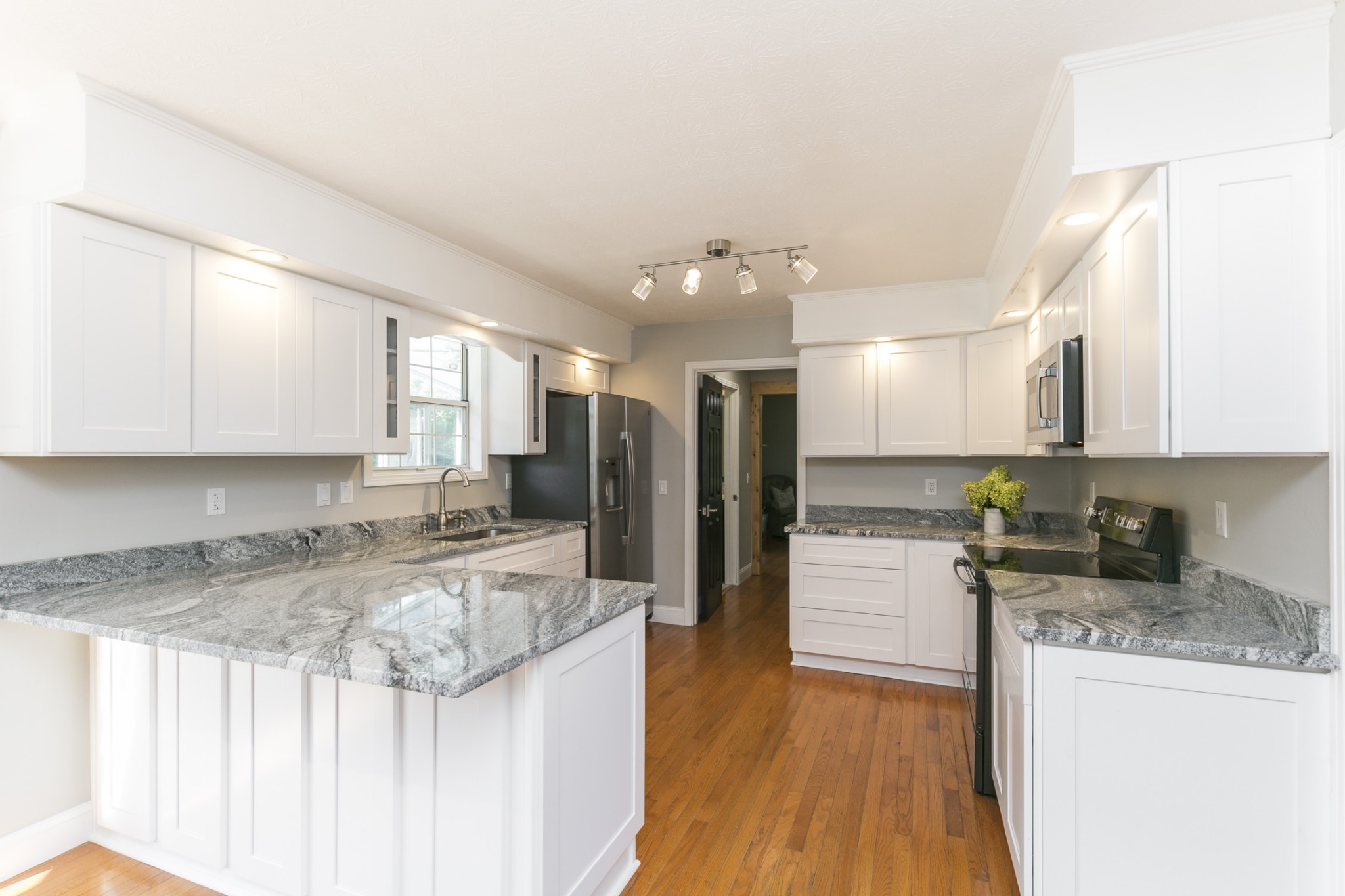 848 Philadelphia Road Lebanon, TN 37087 - Photo 6 of 50 a kitchen with a refrigerator a sink and wooden cabinets