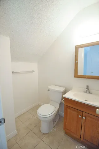 a white toilet sitting next to a bathroom sink