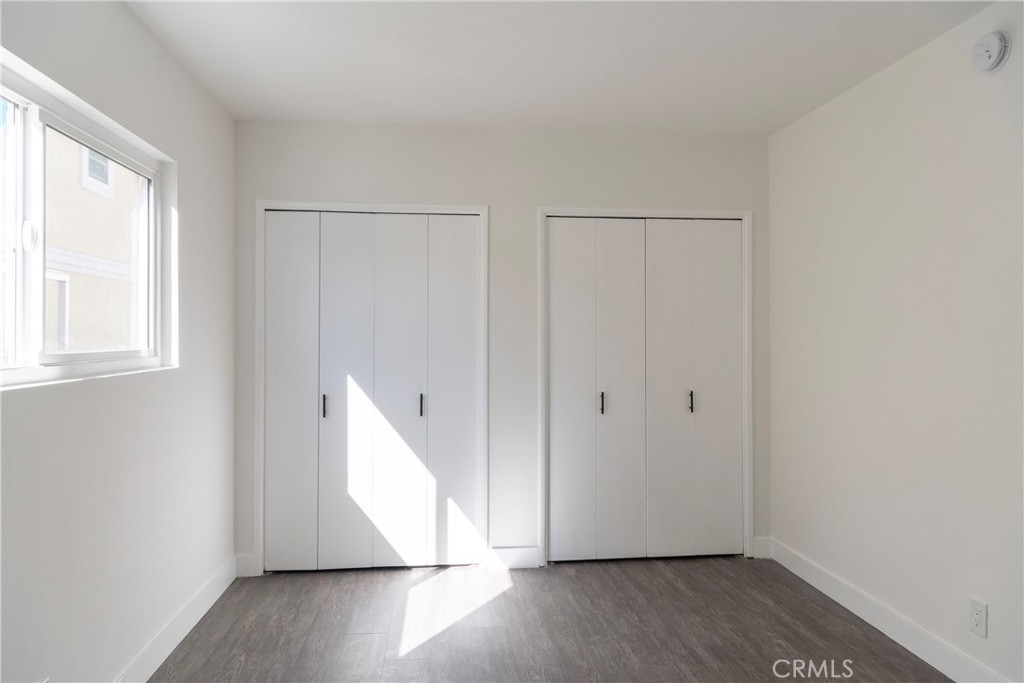 2107 Pullman Lane Redondo Beach, CA 90278 - Photo 15 of 16 an empty room with wooden floor and windows