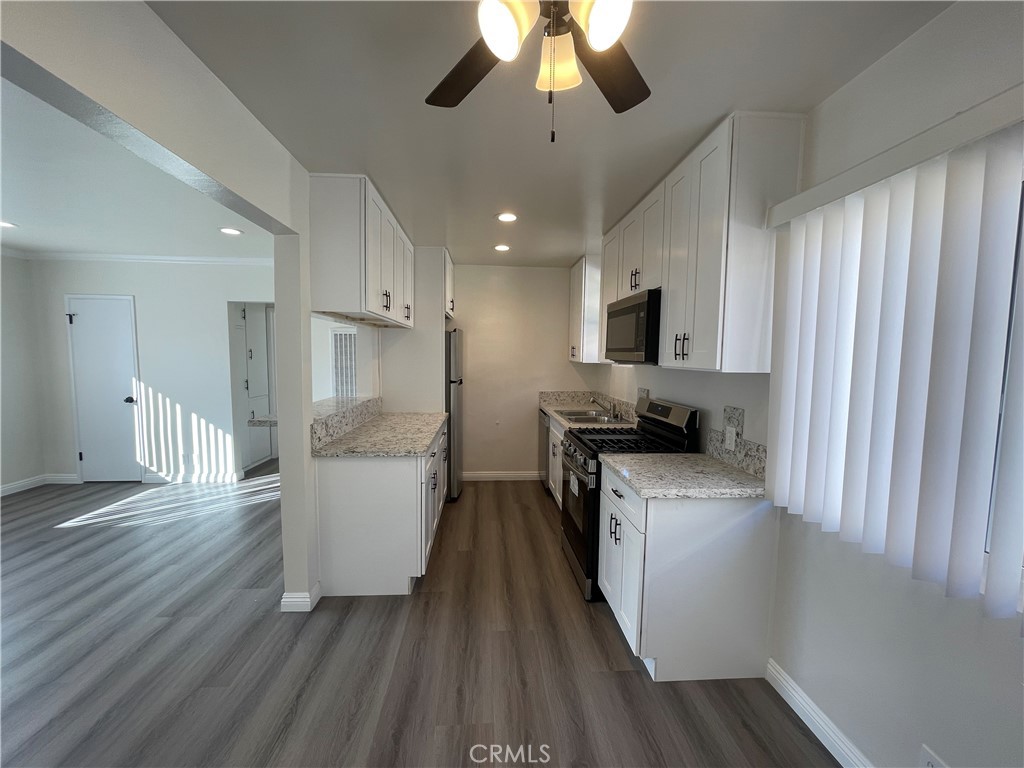 2107 Pullman Lane Redondo Beach, CA 90278 - Photo 7 of 16 a kitchen with a refrigerator and a stove top oven