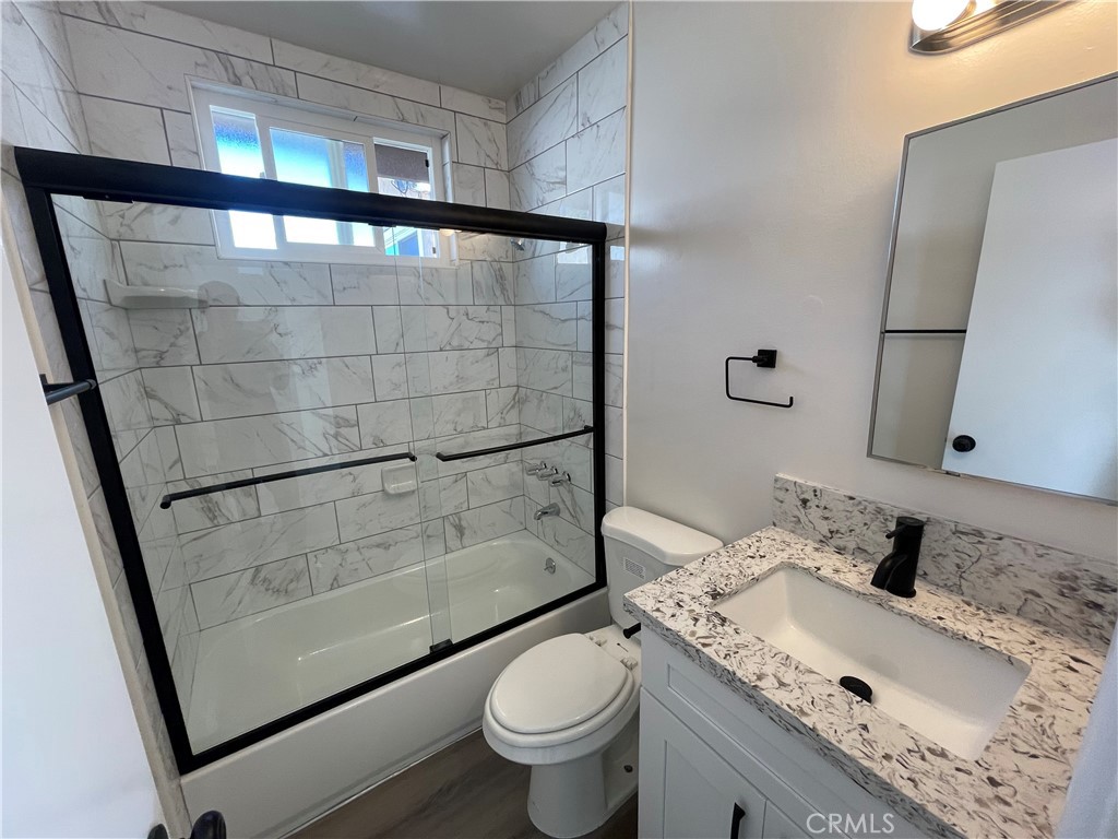 2107 Pullman Lane Redondo Beach, CA 90278 - Photo 9 of 16 a bathroom with a granite countertop sink toilet and shower