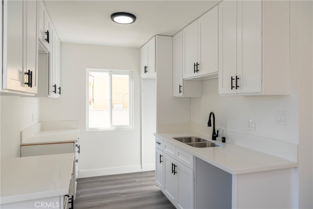 2107 Pullman Lane Redondo Beach, CA 90278 - Photo 10 of 16 a kitchen with white cabinets and sink