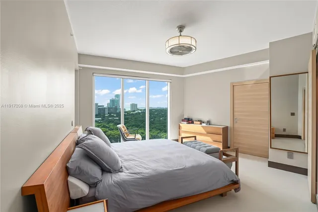 a bedroom with a bed and gym equipment