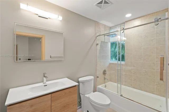 a close view of a utility room with washer and dryer
