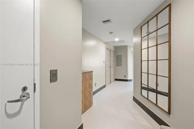 a kitchen with cabinets stainless steel appliances and sink