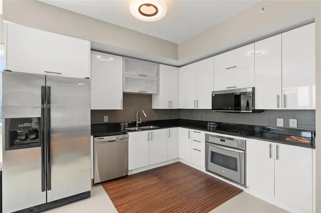 a balcony with tall trees in front of it