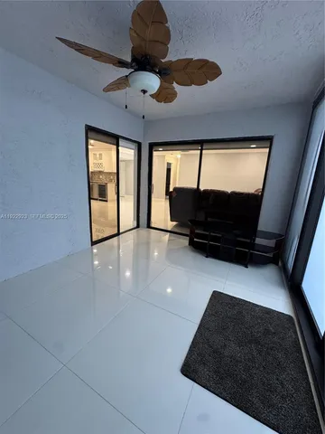 a view of a livingroom with a kitchen