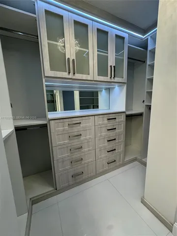 a bathroom with a double vanity sink a toilet and a mirror