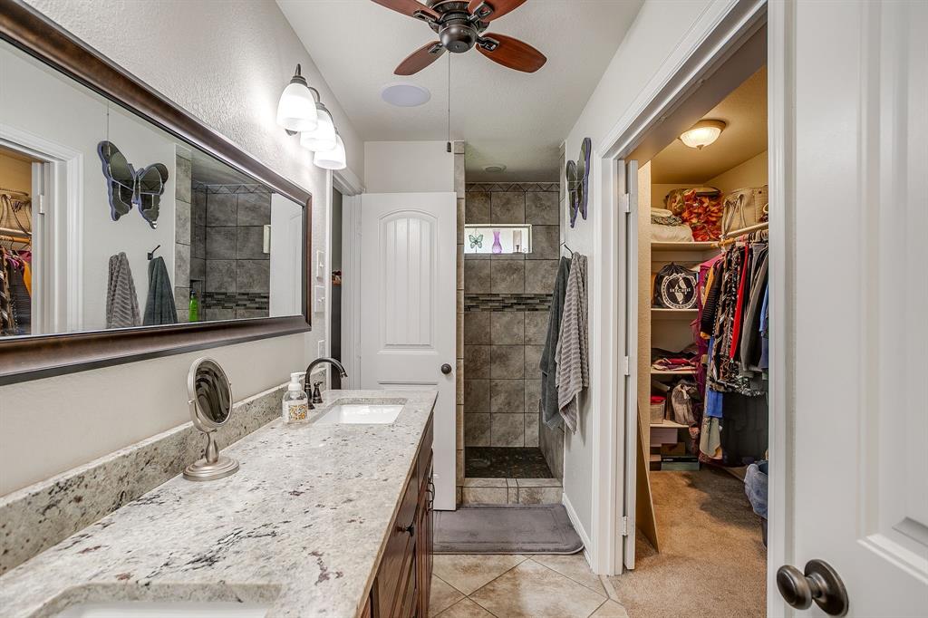 206 King George Way Ponder, TX 76259 - Photo 11 of 32 a bathroom with a sink and a mirror