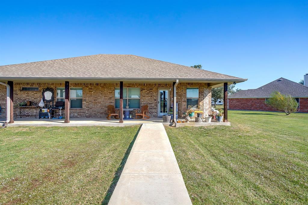 206 King George Way Ponder, TX 76259 - Photo 19 of 32 a view of a house with swimming pool and a yard