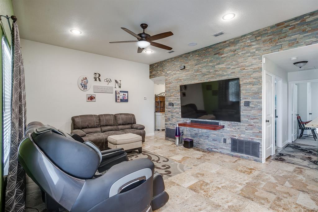 206 King George Way Ponder, TX 76259 - Photo 2 of 32 a living room with furniture and a flat screen tv