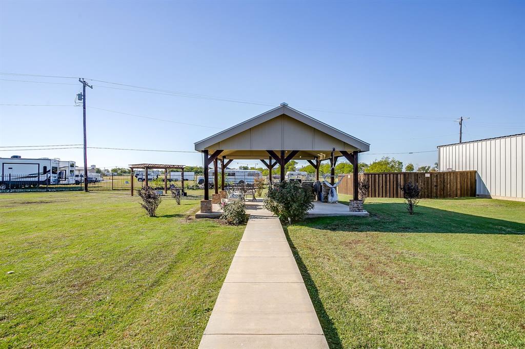 206 King George Way Ponder, TX 76259 - Photo 20 of 32 a view of swimming pool that has wooden bench sitting in the middle