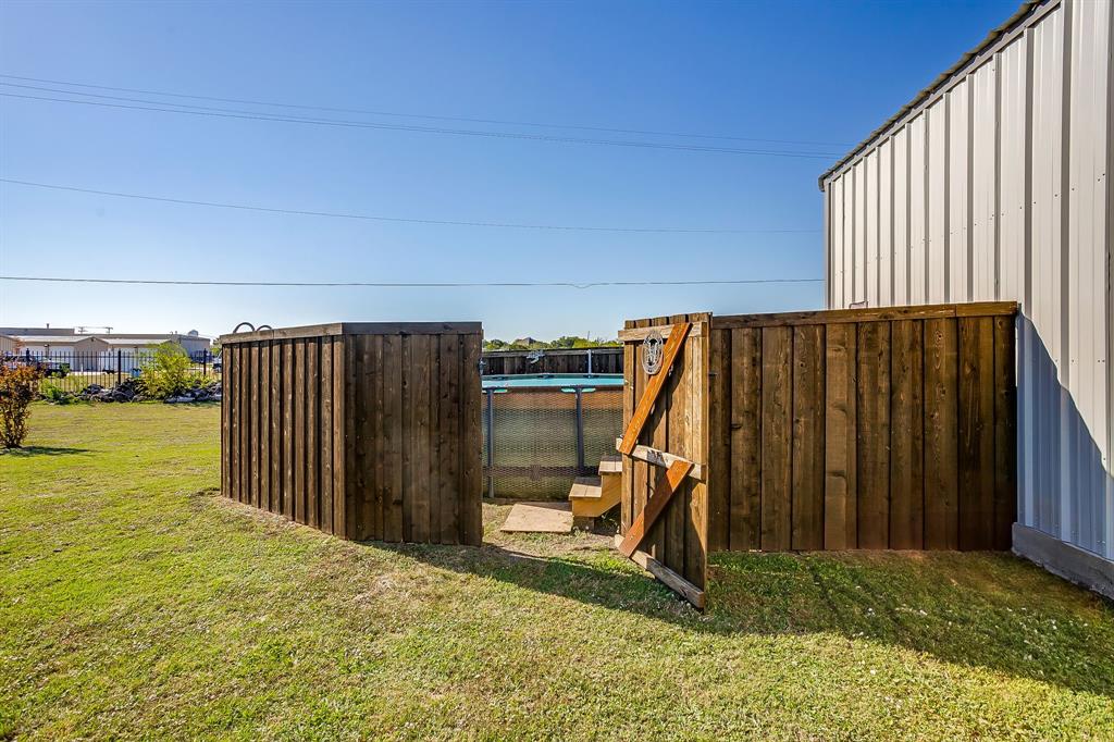 206 King George Way Ponder, TX 76259 - Photo 22 of 32 a view of a backyard of the house