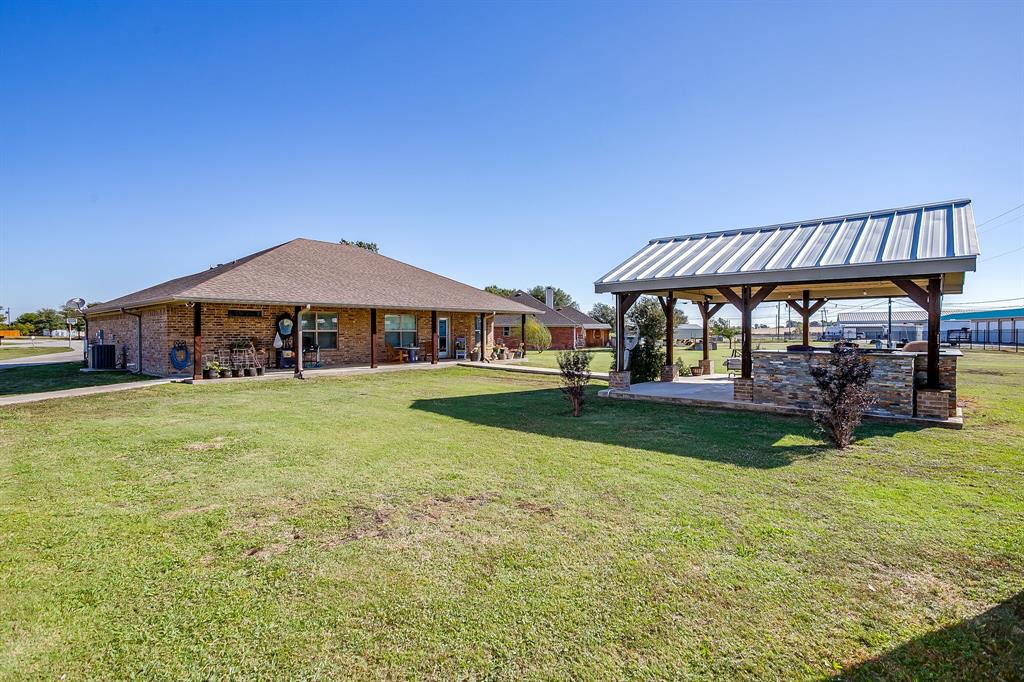 206 King George Way Ponder, TX 76259 - Photo 26 of 32 a view of an house with backyard space and balcony