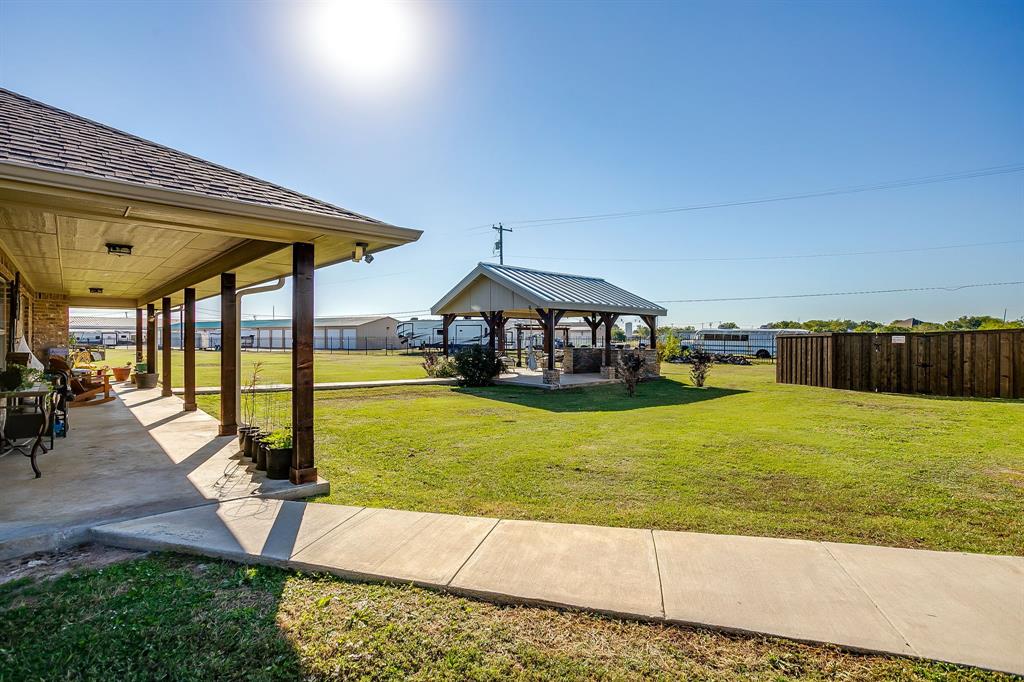 206 King George Way Ponder, TX 76259 - Photo 27 of 32 a house view with a swimming pool