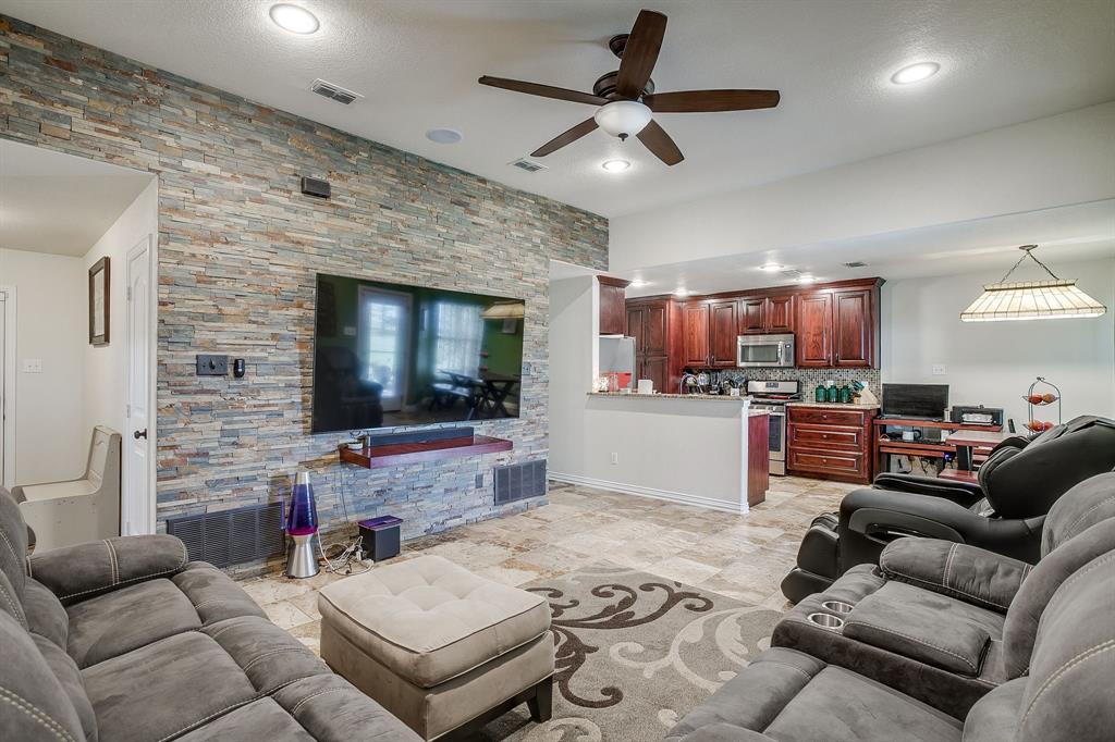 206 King George Way Ponder, TX 76259 - Photo 3 of 32 a living room with furniture and a flat screen tv