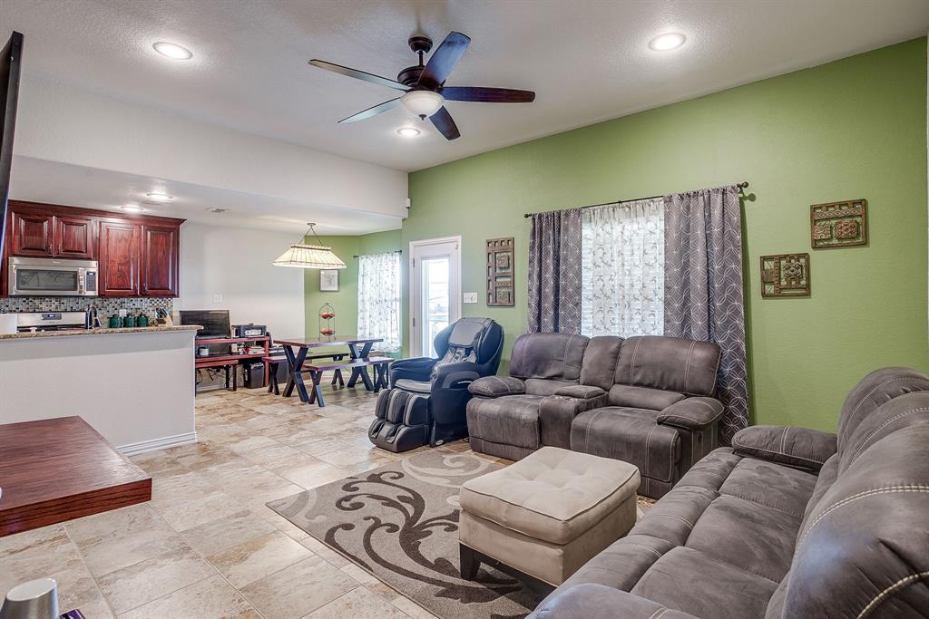 206 King George Way Ponder, TX 76259 - Photo 4 of 32 a living room with furniture kitchen view and a large window