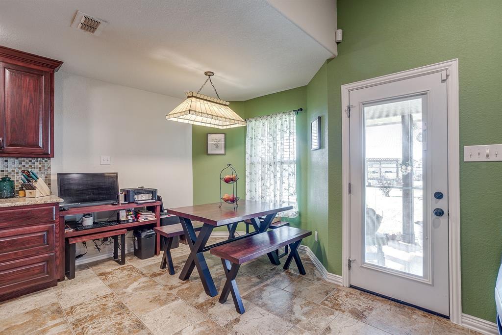 206 King George Way Ponder, TX 76259 - Photo 5 of 32 a living room with furniture a window and a chandelier