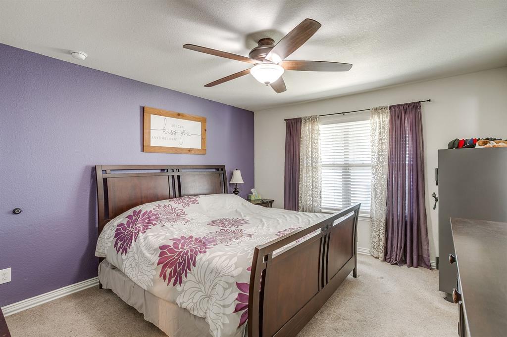 206 King George Way Ponder, TX 76259 - Photo 9 of 32 a bedroom with a bed and a window