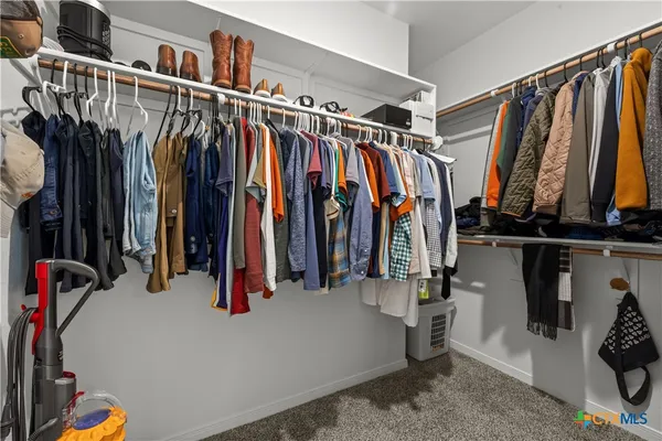 a en suite bathroom with a sink a large mirror and a shower