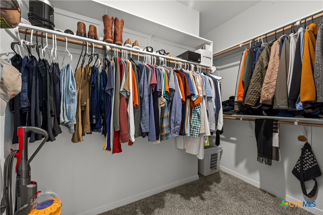 620 Ripplewood Drive Temple, TX 76502 - Photo 16 of 29 a view of walk in closet with clothes and shoes