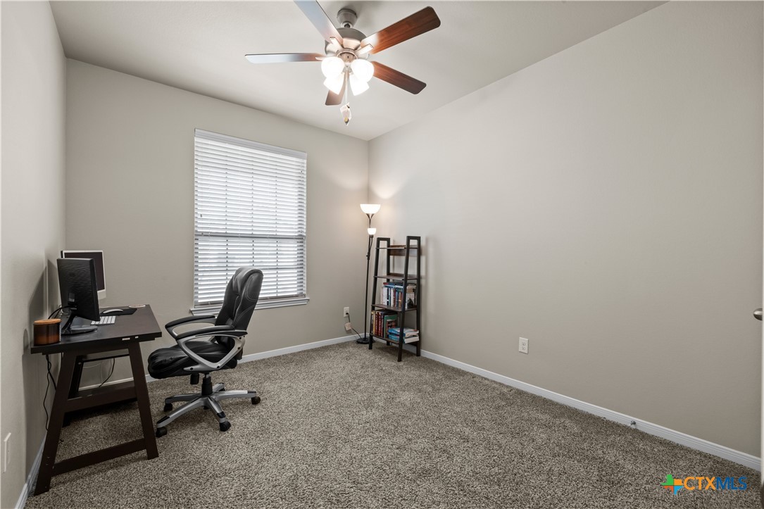 620 Ripplewood Drive Temple, TX 76502 - Photo 21 of 29 a view of a workspace with furniture and a window