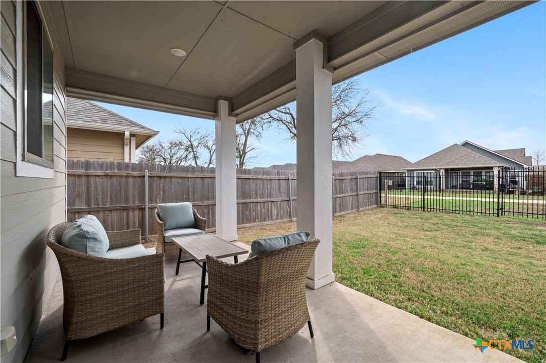 620 Ripplewood Drive Temple, TX 76502 - Photo 23 of 29 a balcony with furniture and a garden