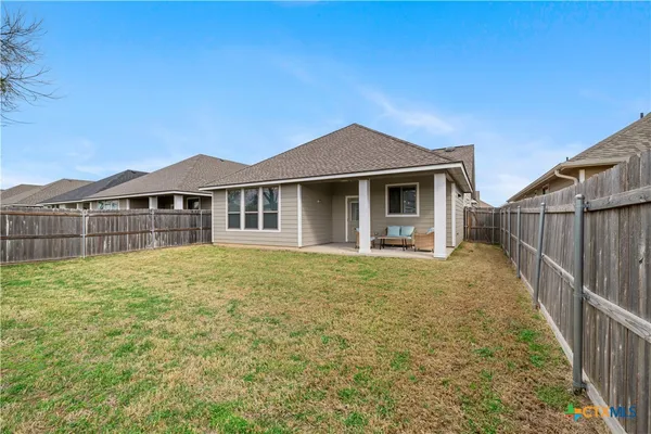 a house with yard in front of it