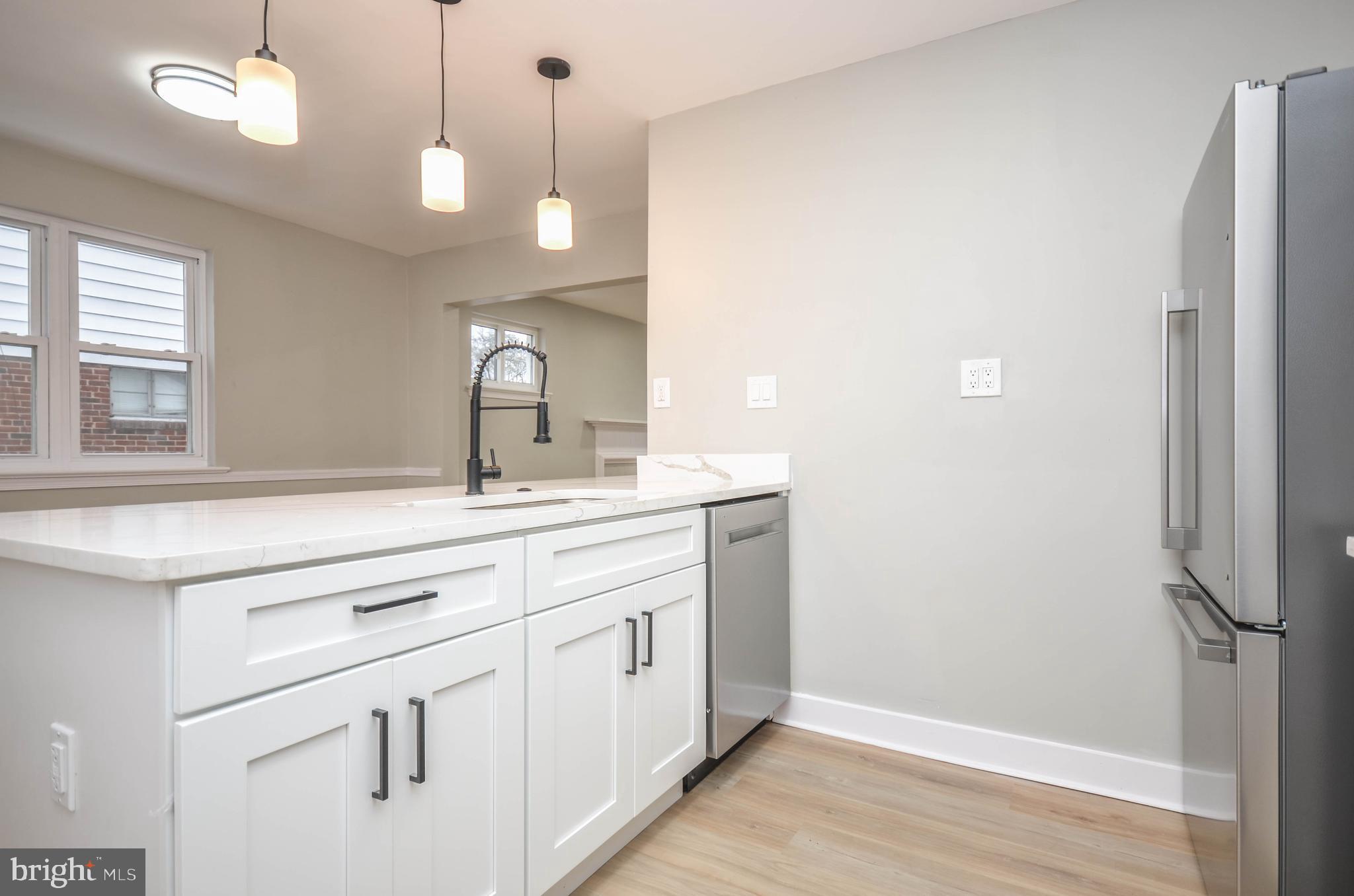 2110 Rolander Street Hyattsville, MD 20783 - Photo 13 of 33 a bathroom with a double vanity sink and a mirror