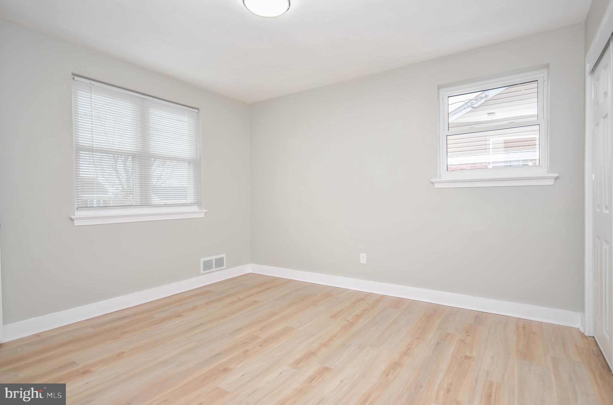2110 Rolander Street Hyattsville, MD 20783 - Photo 17 of 33 an empty room with wooden floor and windows