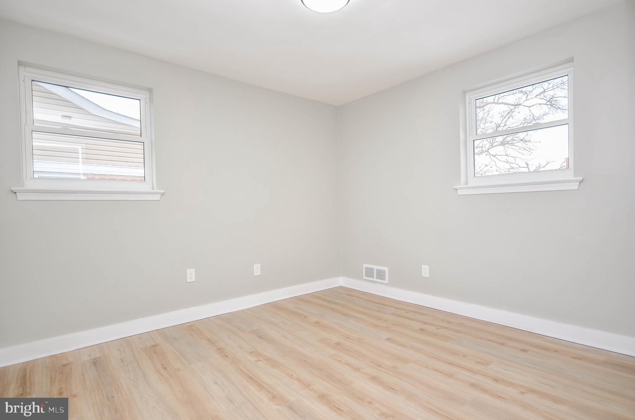 2110 Rolander Street Hyattsville, MD 20783 - Photo 18 of 33 an empty room with wooden floor and windows