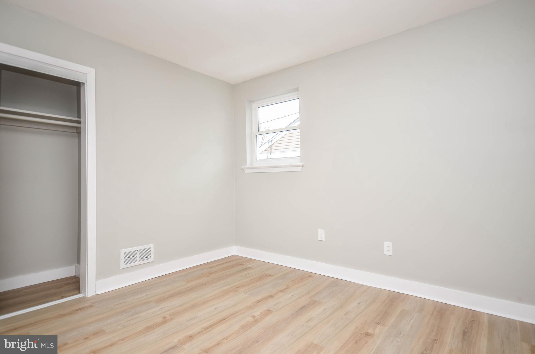 2110 Rolander Street Hyattsville, MD 20783 - Photo 19 of 33 a view of an empty room with wooden floor and a window