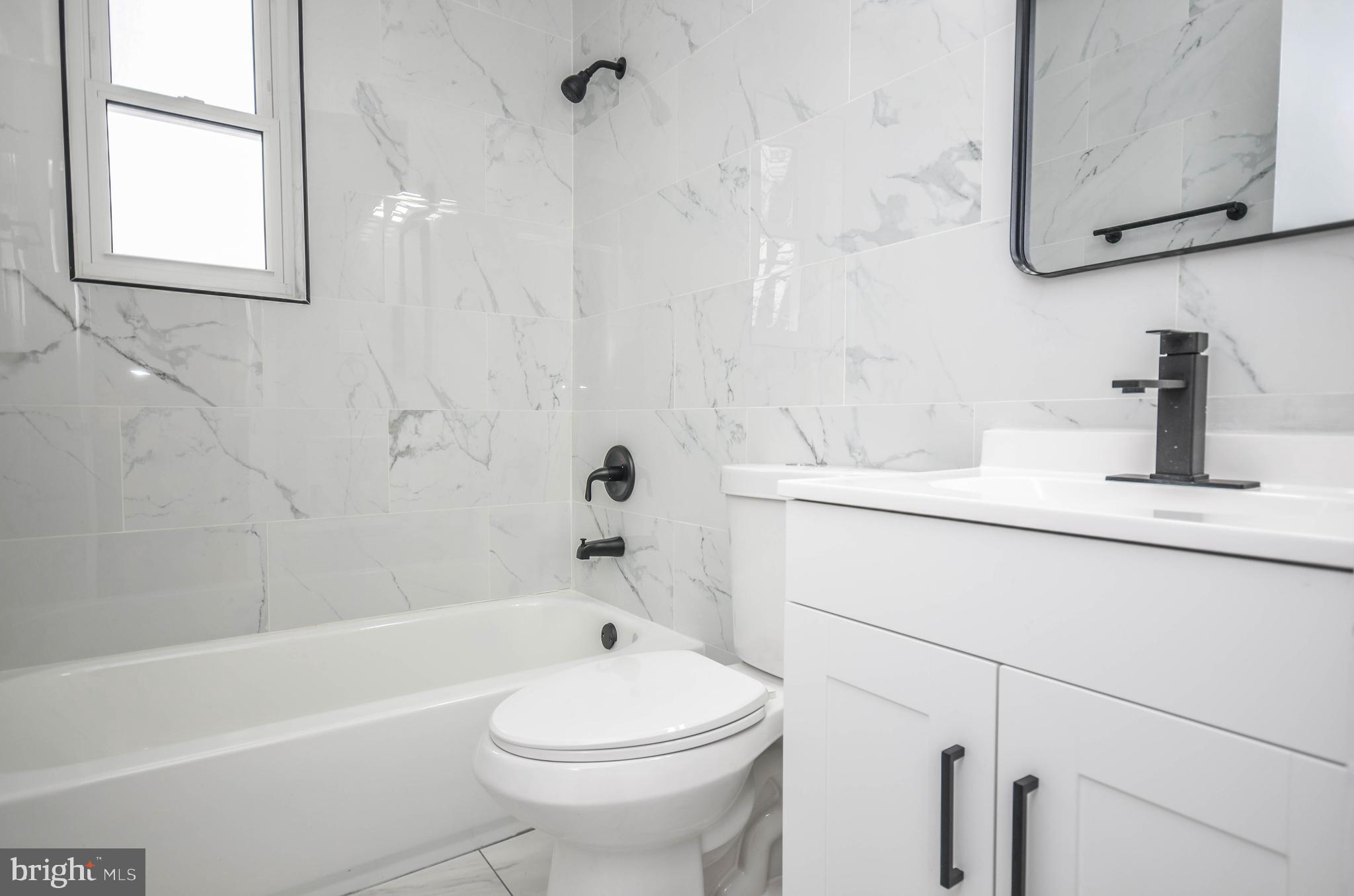 2110 Rolander Street Hyattsville, MD 20783 - Photo 20 of 33 a bathroom with a sink a toilet and a bathtub