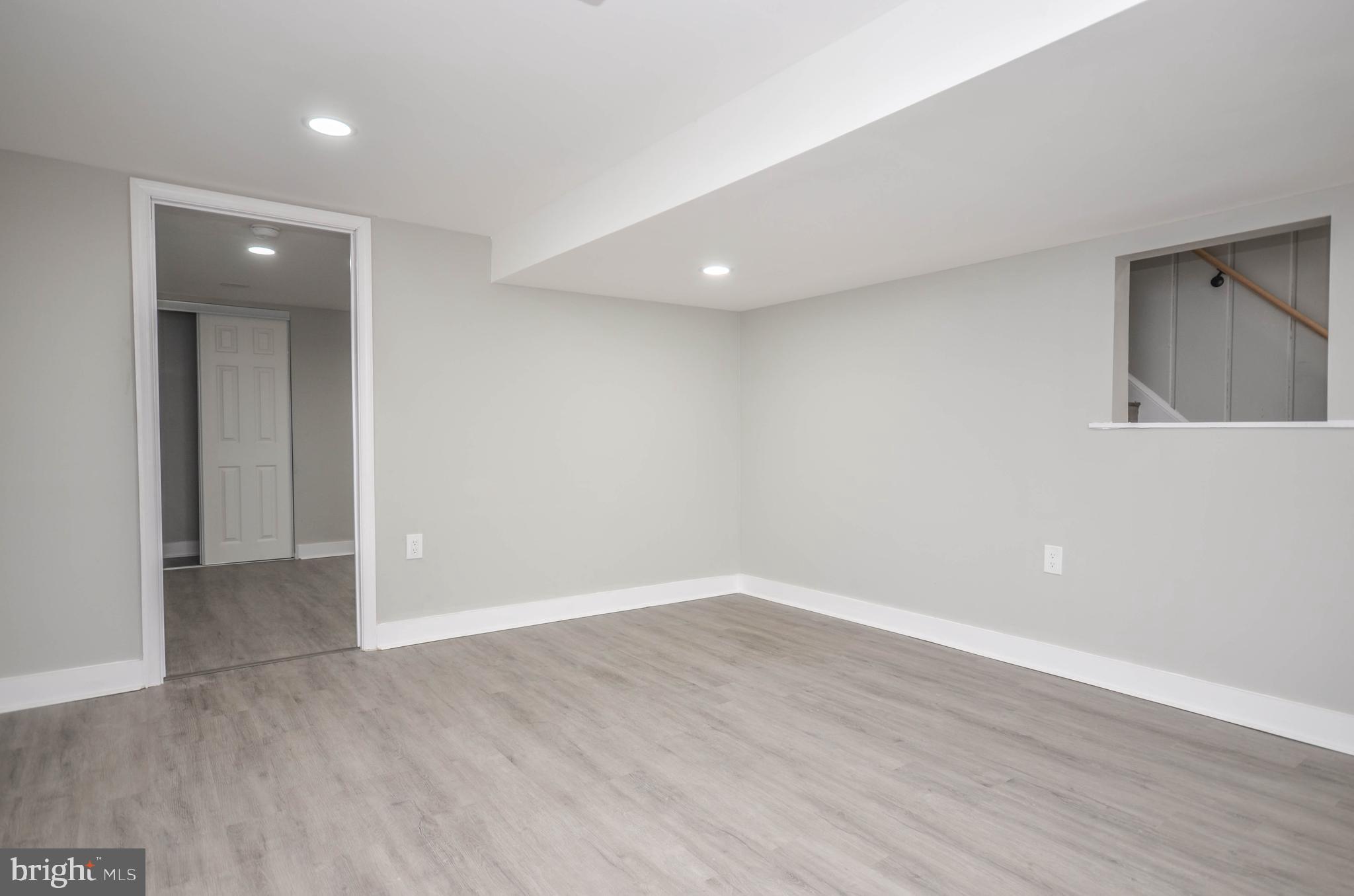 2110 Rolander Street Hyattsville, MD 20783 - Photo 23 of 33 a view of an empty room with wooden floor