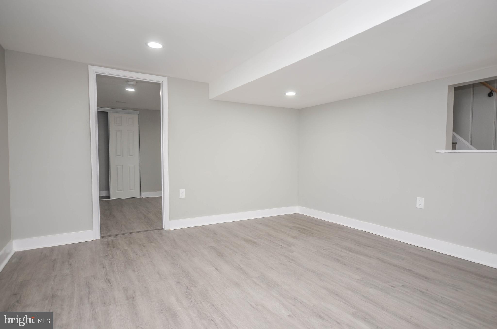 2110 Rolander Street Hyattsville, MD 20783 - Photo 24 of 33 a view of an empty room with wooden floor and closet