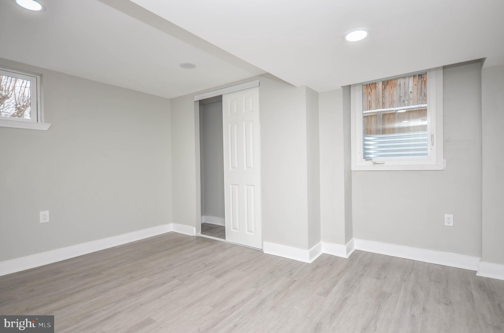2110 Rolander Street Hyattsville, MD 20783 - Photo 31 of 33 an empty room with wooden floor and windows