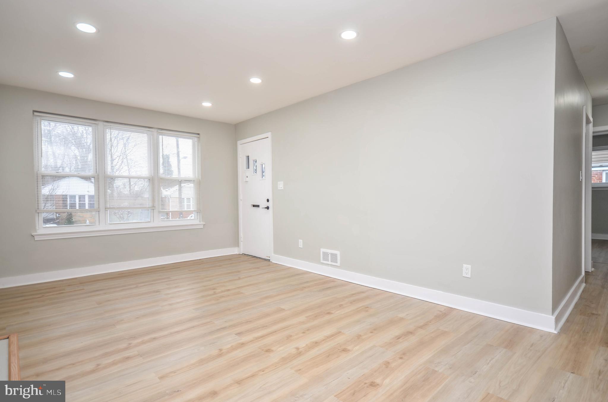 2110 Rolander Street Hyattsville, MD 20783 - Photo 7 of 33 wooden floor in an empty room with a window