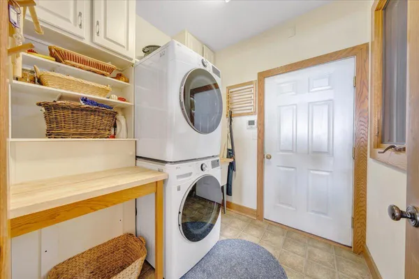 a bathroom with a granite countertop sink and a bathtub