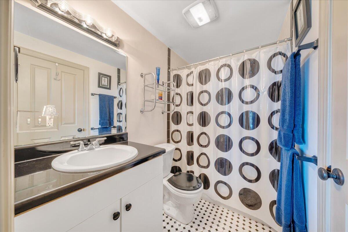 490 Lookout Ridge Lane Copper Hill, VA 24079 - Photo 48 of 69 a bathroom with a granite countertop sink a mirror a lamp