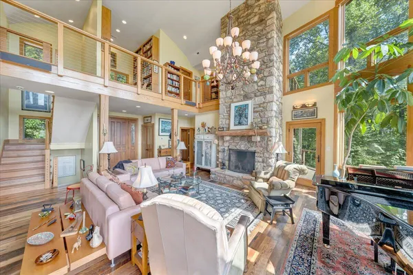 a kitchen with granite countertop a large window and a sink