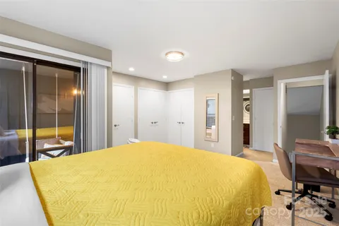 a bedroom with a bed and a table