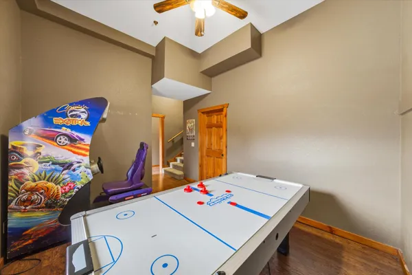 a bed room with furniture and a flat screen tv