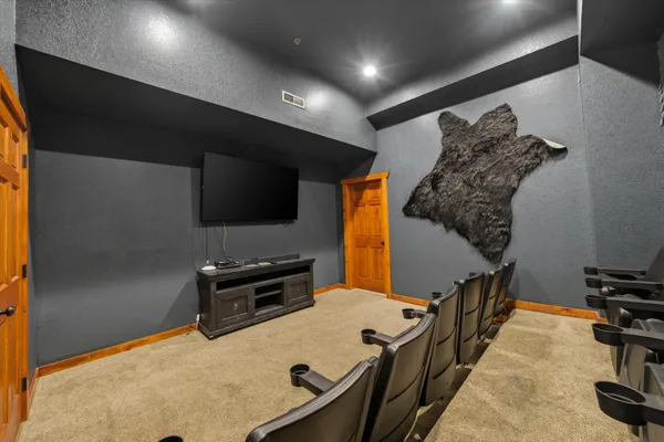 a bedroom with a large bed and a tv