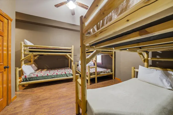 a view of a room with wooden floor