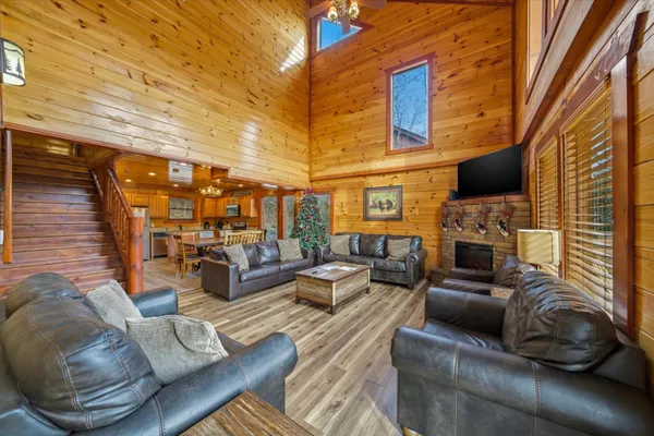 a rooftop view with couches and a potted plant on the table