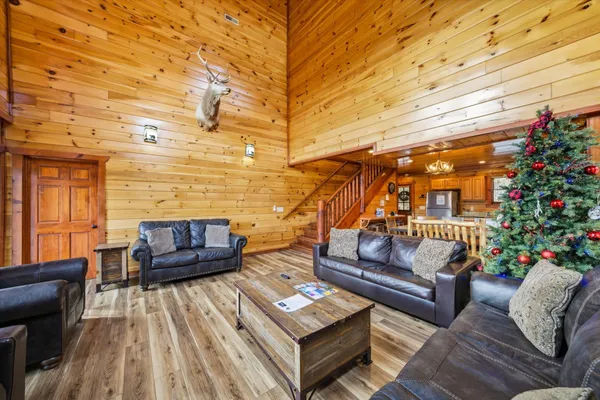 a dining room with furniture and wooden floor