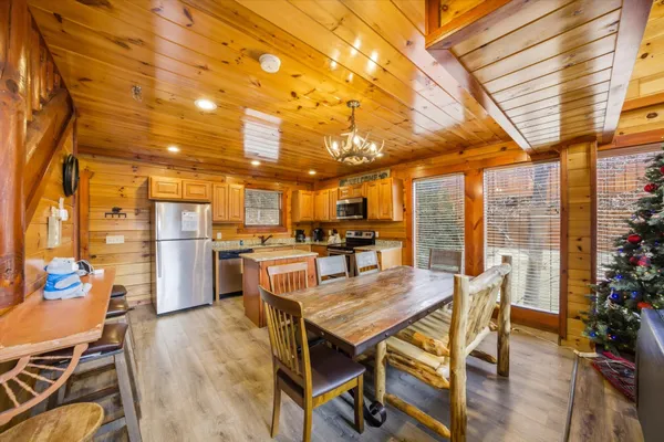 a kitchen with stainless steel appliances granite countertop sink stove top oven and cabinets