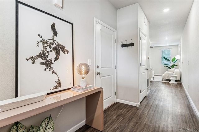 a living room with furniture or kitchen and a wooden floor