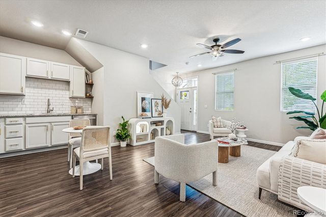 a living room with furniture and a table